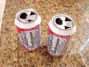 Two beer cans prepared for chicken insertion
