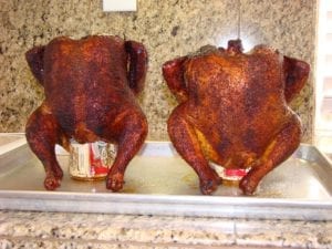 Two finished beer can chickens, cooling before serving