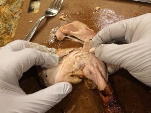 Pulling dark meat from leg quarter