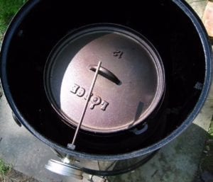 Lidded Dutch oven sitting in water pan