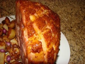 Close-up of diamond-scored and glazed surface of ham