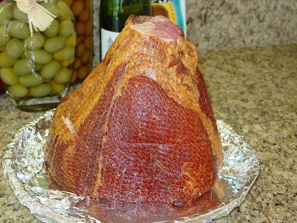Ham face down on foil-lined pan