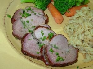 Boneless leg of lamb with roasted garlic jus