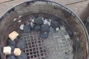 Pile of lit briquets bumps up cooker temp