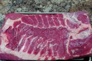 Pork belly removed from packaging