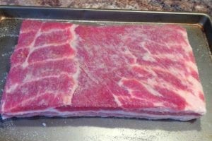 Cure applied to pork belly
