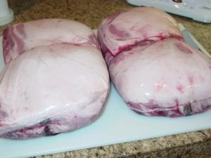 Four boneless, untrimmed pork buts in Cryovac