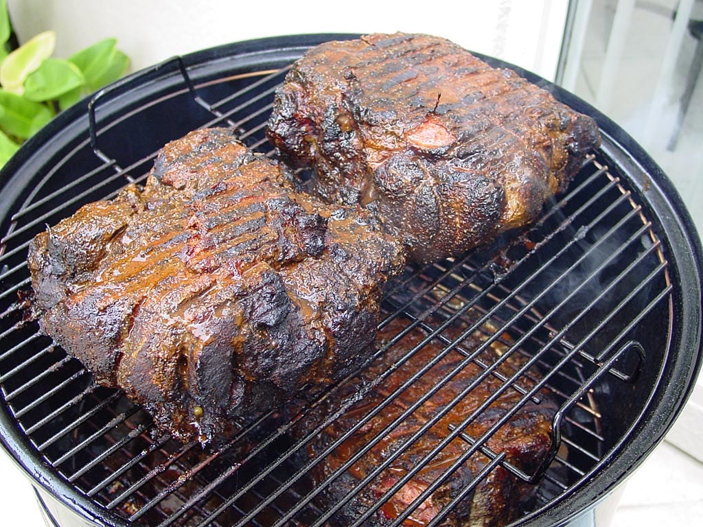 Turning the pork butts