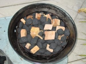 Smoke wood mixed into unlit Kingsford charcoal briquettes