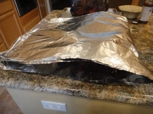 Folding foil over pork butt