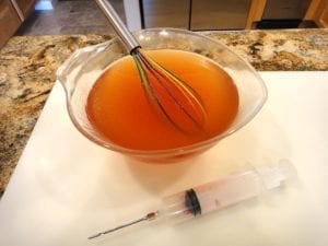 Injection solution and injector