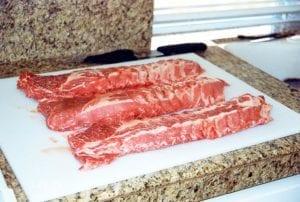 Three untrimmed slabs of loin back ribs