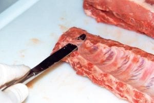 Prying up the membrane with a butter knife