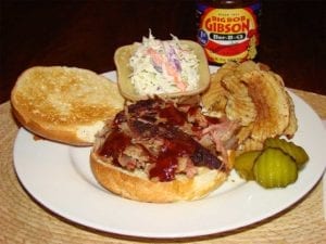 Championship injected pulled pork sandwich and side dishes