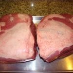Two untrimmed pork butts removed from packaging