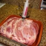 Injecting solution into pork butt