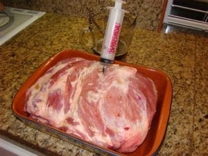Injecting solution into pork butt