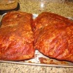 Two injected and rubbed pork butt ready for cooking