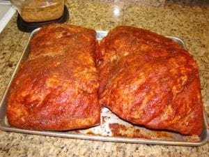 Two injected and rubbed pork butt ready for cooking
