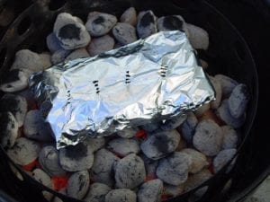 Foiled wood chips on hot coals