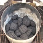 Half full Weber chimney of unlit Kingsford charcoal