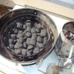 Unlit briquettes in charcoal chamber