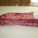 Three slabs of loin back ribs in Cryovac packaging