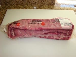 Three slabs of loin back ribs in Cryovac packaging