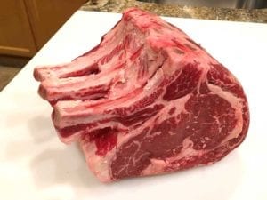 Rib roast unwrapped, bone side up