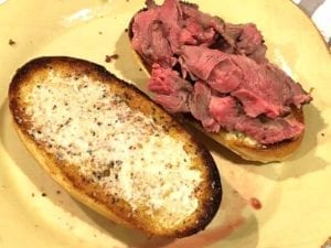 Thinly sliced prime rib sandwich