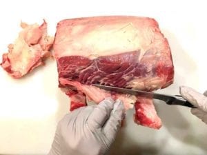 Trimming off part of the fat cap
