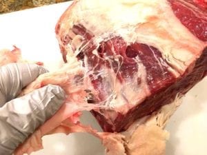 Pulling off another area of fat cap