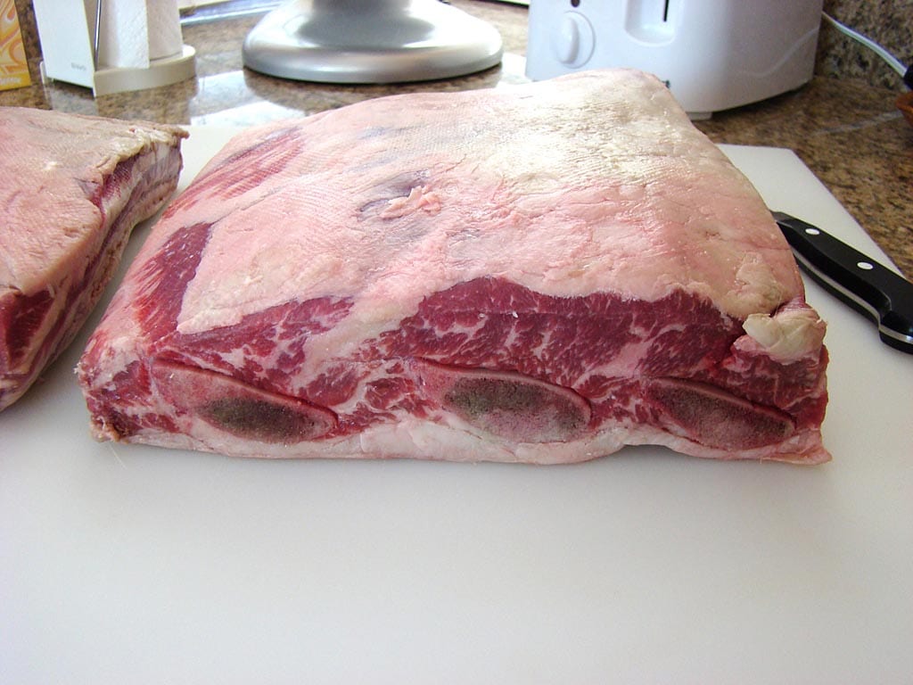 Edge view showing three bones and thickness of fat and meat