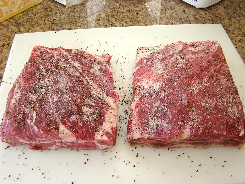 Generous application of rub on beef short ribs