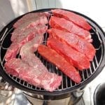 Short ribs arranged on top cooking grate