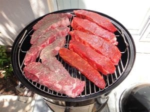 Short ribs arranged on top cooking grate