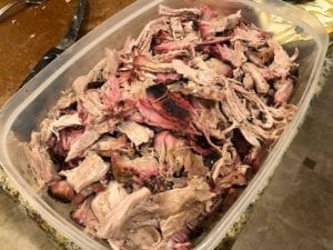 Large container of pulled pork butt