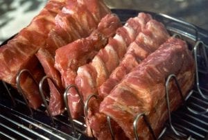 Half slabs of pork loin back ribs in rib rack