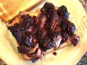 Close-up of rib sandwich on toasted bread