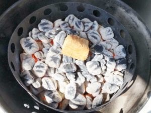 One chunk of cherry smoke wood on hot coals