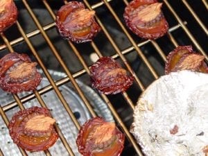 One dried tomato among others not yet dried