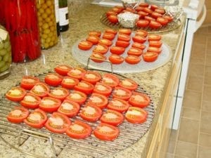 Tomato halves arranged on grates