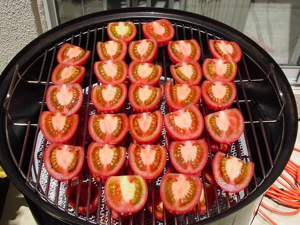 Tomatoes on top cooking grate