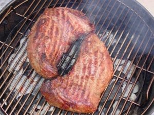 Searing tri-tip roasts over hot coals