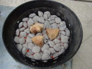 Hot coals with apple wood applied