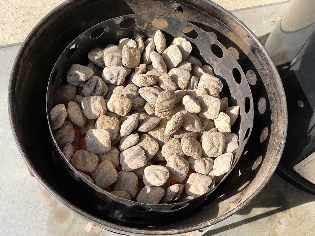 Hot charcoal briquets in WSM