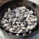 Two chimneys of hot coals spread inside the charcoal chamber