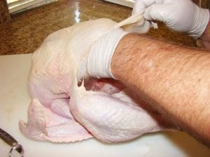 Rubbing salt on the breast meat