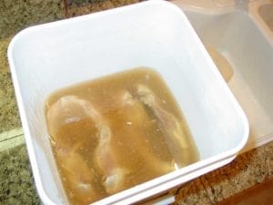 Two turkey breasts in brine solution