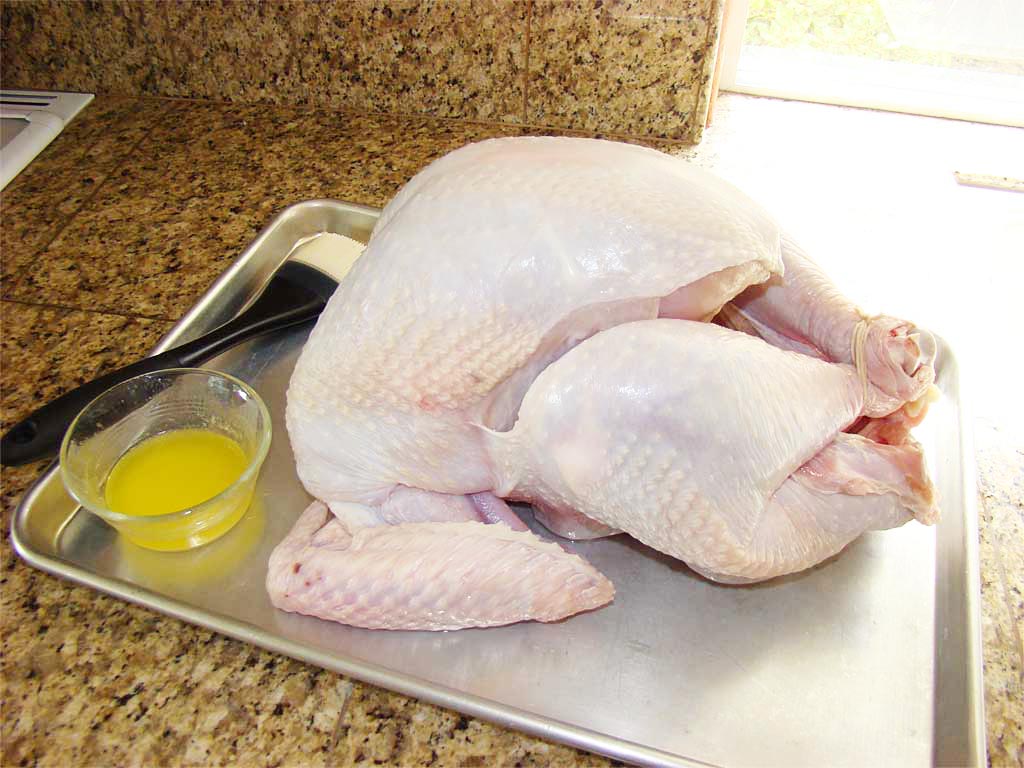 Salted turkey ready for brushing with melted butter